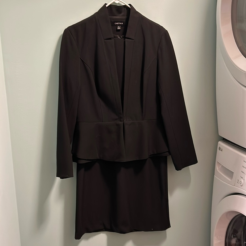 Black jacket and sleeveless dress
